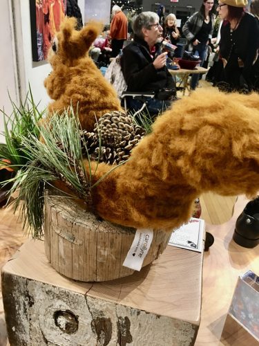 Sole Train to the Night Market, a partnership between Fluevog Shoes and Arts Community Victoria. Opening at Fluevog Shoes, 566 Johnson Street Nov 15th at 7-9pm. Show runs until Nov 30. My #needlefelted #wearable #squirrel #slipper and it’s #shadow Most new pine trees begin when the tiny seeds are blown about by the wind once released from the cone. although some are begun when birds and squirrels feed on the seeds and distribute them. This sculpture is a wearable shoe / slipper that is filled with pine cones that can be used to metaphorically spread the seeds for new pine trees to grow. Squirrel Shoe: Nature’s Natural Gardener Spreading the Seeds, Needle felting wool, reindeer slipper, beach combed timber, locally foraged pine fronds and cones, 13″ x 17″ x 15″, 2018