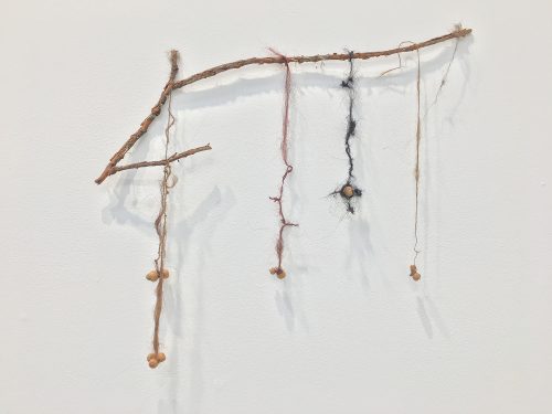 Holobionts 21 (detail). Squirrel hair, cat hair, magnolia petals, leaf skeleton, human hair, 30% wood fibre acrylic, wax, feather, oak tree branch, acorns, 2019.