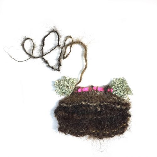 Semiotic silence A, from the Hologenome Series, 14″ x7″ x 1.25, 2020, knitted human hair, lichen on Garry oak branch (sustainably foraged from ground after windstorm), reflective plastic left by city workers . 6″ x 6″ 2″