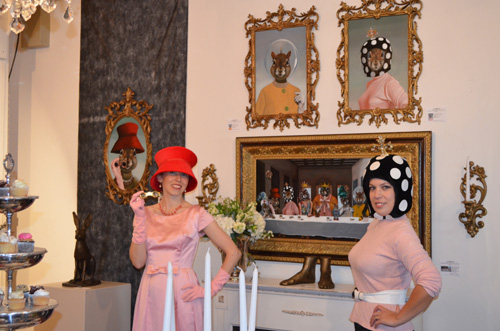 Red Hat (Tierre Joline) and Mushroom Hat (Danica Wilcox) in front of Never Dine Alone: Squirrel Banquet