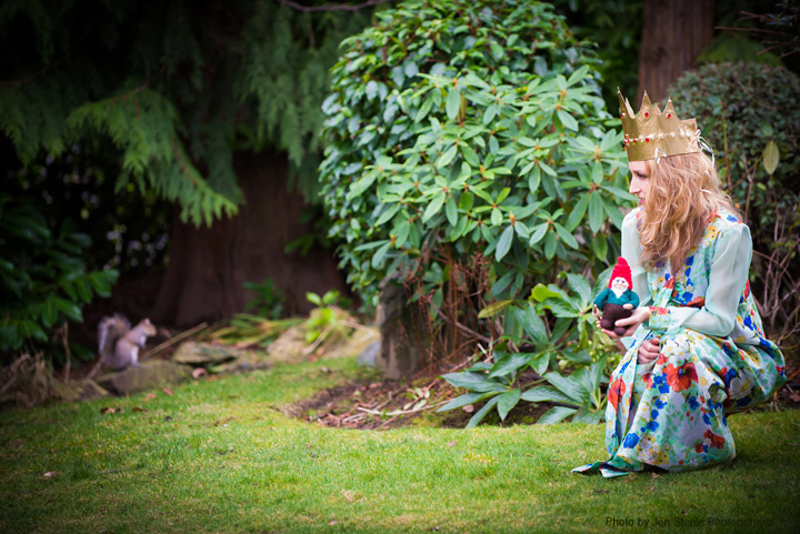 Carollyne Yardley with gnome, and squirrel in the garden. Photo by Jen Steele Photography