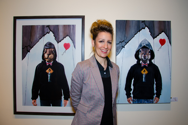 Carollyne Yardley in front of her artwork. Photo by Matthew Schlauch, Snapd Magazine, Dec 2013.