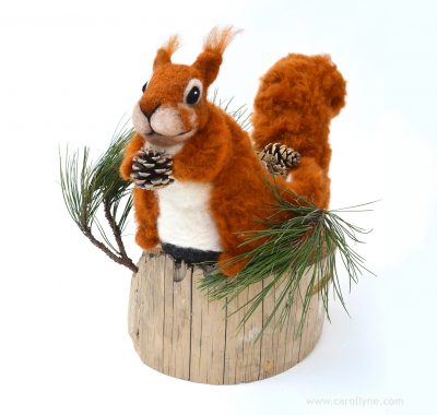 Squirrel: Nature's Natural Gardener, Needle felting wool, reindeer slipper, beach combed timber, locally foraged pine fronds and cones, 13" x 17" x 15", 2018.