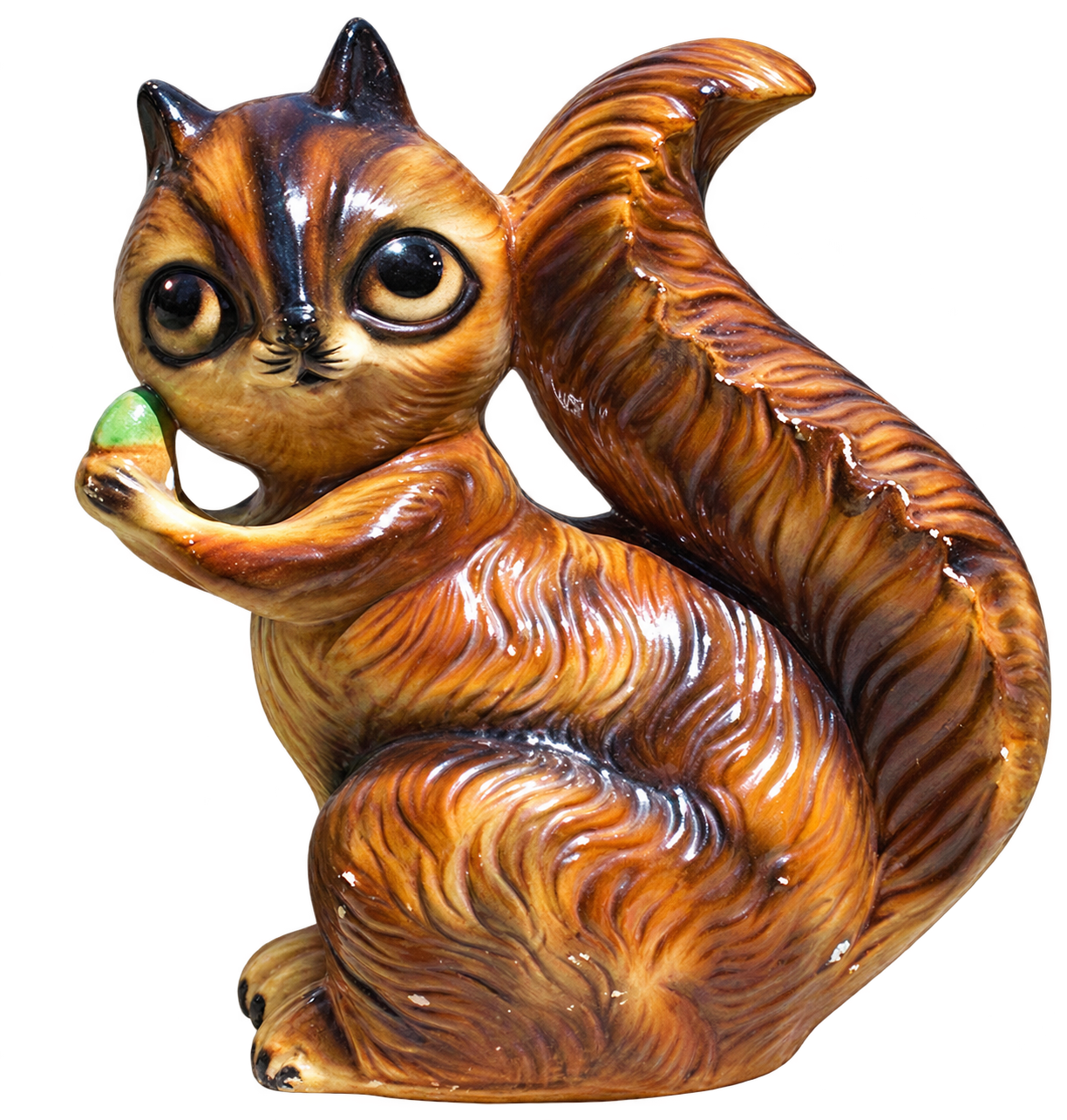 Vintage brown squirrel-shaped coin bank holding a green nut